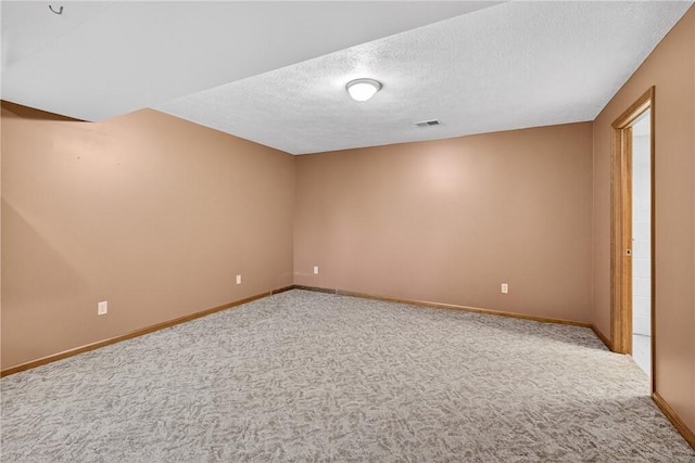 228 Bowman Rd, South Fayette, PA 15017 - carpeted empty room with a textured ceiling and baseboards