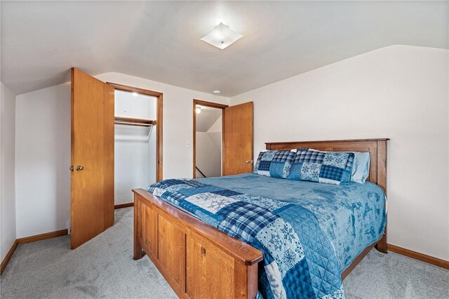 4457 Woodhill Dr, Munhall, PA 15120 - bedroom featuring light carpet, lofted ceiling, and a closet