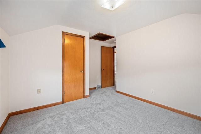 4457 Woodhill Dr, Munhall, PA 15120 - unfurnished bedroom featuring vaulted ceiling, carpet flooring, and attic access