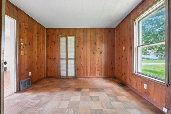 1112 Grigsby, Shenango Twp Law, PA 16101 - spare room featuring wooden walls, healthy amount of natural light, and light floors