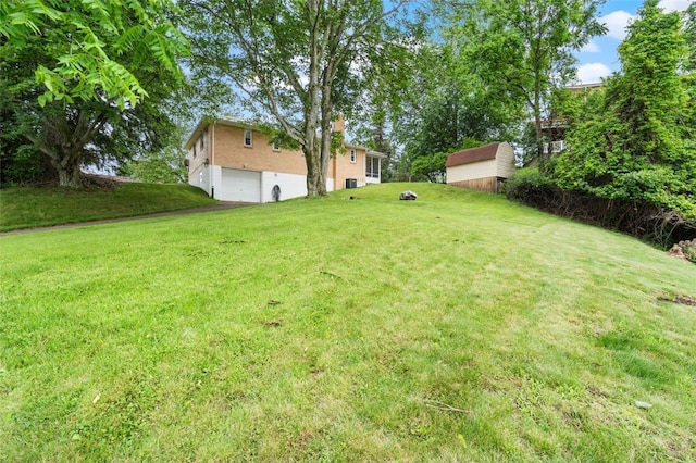 200 Anderson Pl, Shaler, PA 15116 - view of grassy yard with an attached garage and a shed