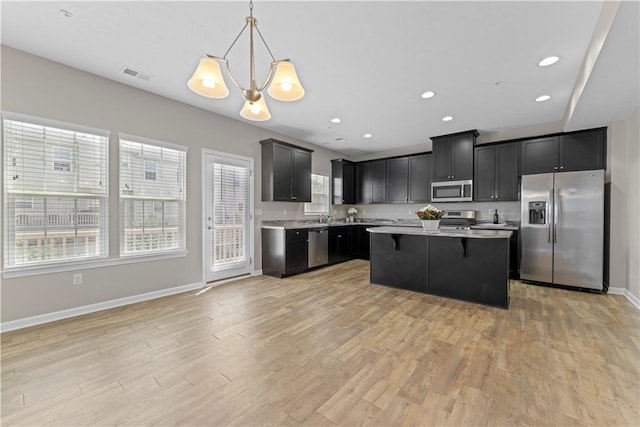 2804 Pointe View Dr, Adams Twp, PA 16046 - kitchen with stainless steel appliances, light countertops, light wood-style floors, dark cabinetry, and recessed lighting