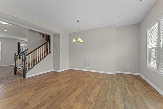 2804 Pointe View Dr, Adams Twp, PA 16046 - unfurnished room with stairs, a chandelier, and wood finished floors