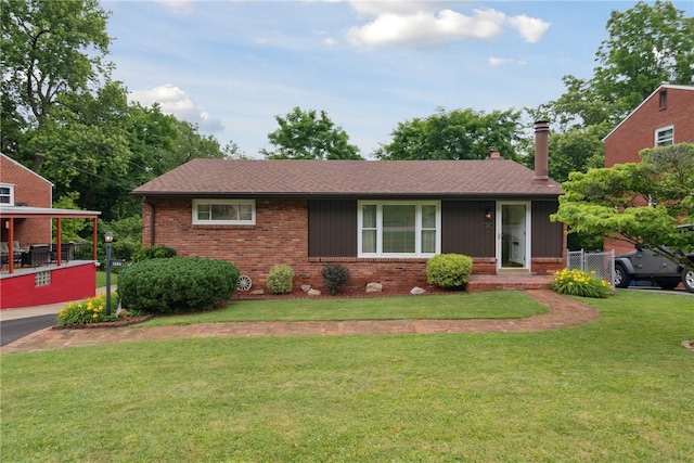 1286 Grouse Dr, Pittsburgh, PA 15243 - view of front facade with brick siding, a front yard, a chimney, and roof with shingles