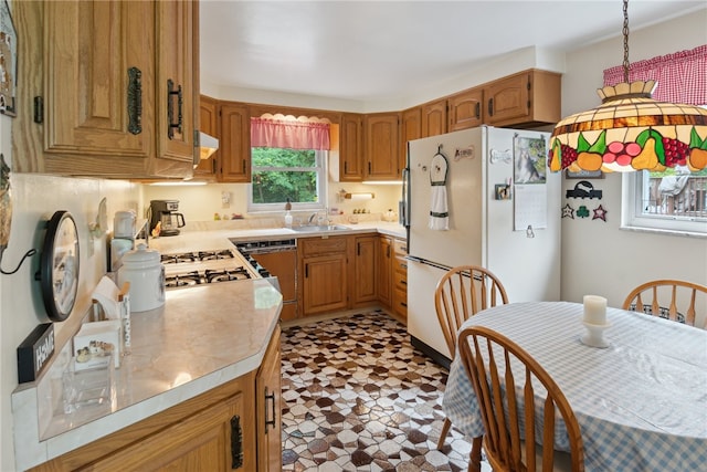 1286 Grouse Dr, Pittsburgh, PA 15243 - kitchen featuring freestanding refrigerator, dishwashing machine, light countertops, tile patterned floors, and brown cabinets