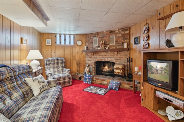 1286 Grouse Dr, Pittsburgh, PA 15243 - living room with carpet floors, wooden walls, a fireplace, and a drop ceiling