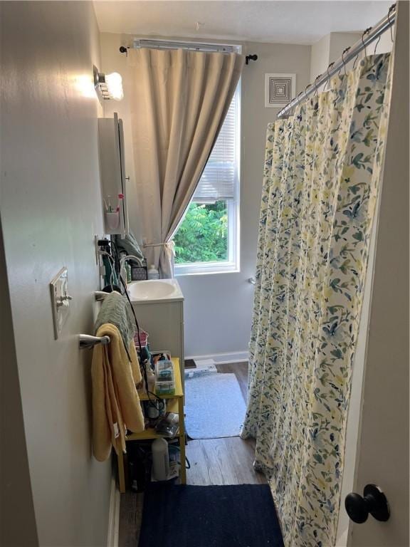 38 Rostock St, Spring Hill, PA 15212 - full bathroom with vanity, wood finished floors, and curtained shower