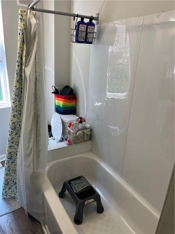 38 Rostock St, Spring Hill, PA 15212 - full bath featuring shower / bathtub combination with curtain and wood finished floors
