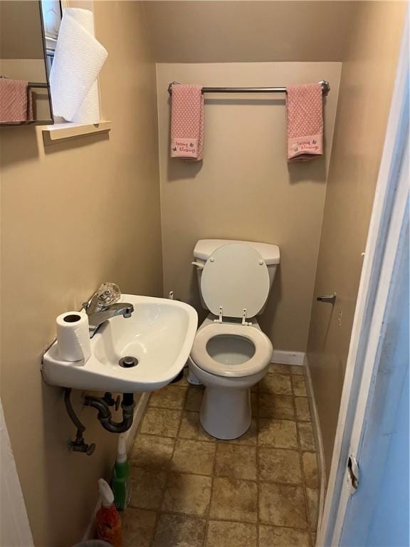 38 Rostock St, Spring Hill, PA 15212 - half bath featuring a sink and stone finish floors