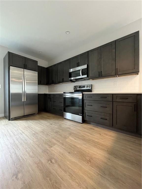 843 Ledlie St, Hill District, PA 15219 - kitchen featuring appliances with stainless steel finishes, light wood-type flooring, and light countertops