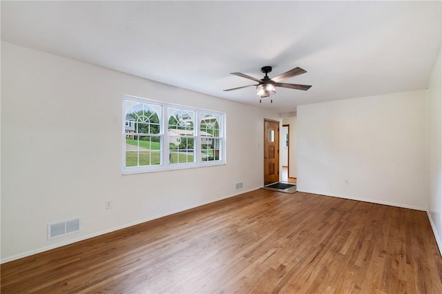 4421 Logan Ferry Rd, Murrysville, PA 15668 - empty room with light wood-type flooring and a ceiling fan