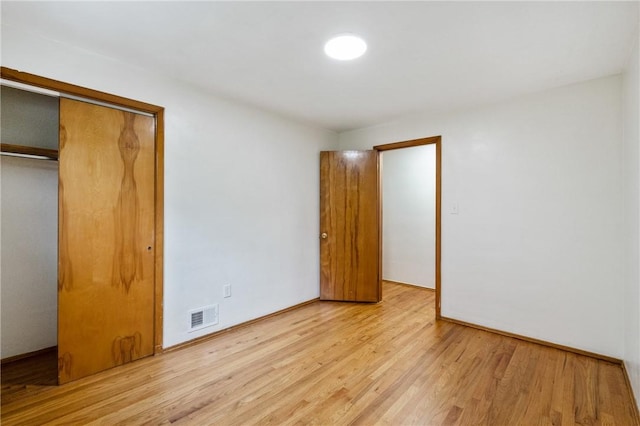 4421 Logan Ferry Rd, Murrysville, PA 15668 - unfurnished bedroom featuring light wood-style floors and a closet