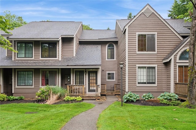 1147 Tanyard Ln, Hidden Valley, PA 15502 - view of front facade with covered porch, a front lawn, and roof with shingles
