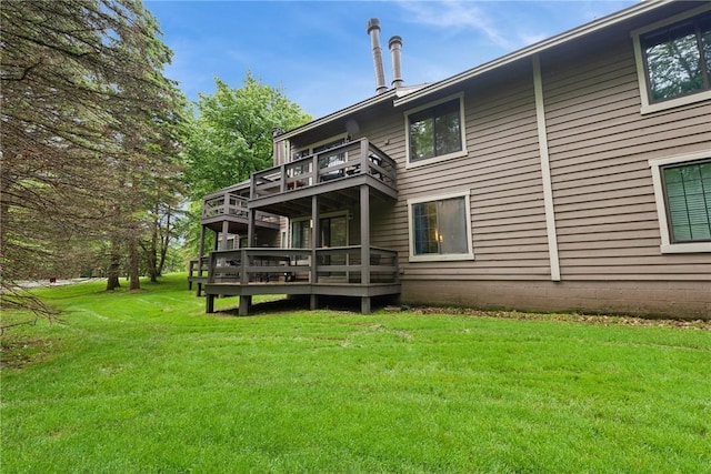 1147 Tanyard Ln, Hidden Valley, PA 15502 - rear view of house with a balcony, a lawn, and a deck