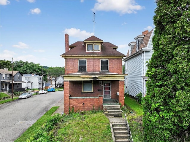 1201 3rd Ave, Beaver Falls, PA 15010 - american foursquare style home with brick siding, a chimney, a porch, and a residential view