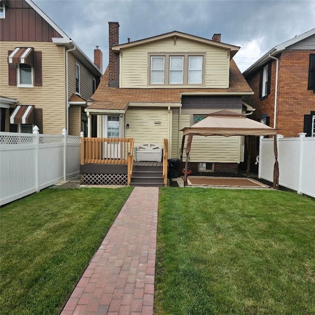 405 Penn Ave, New Brighton, PA 15061 - rear view of property featuring a wooden deck, a chimney, and a shingled roof