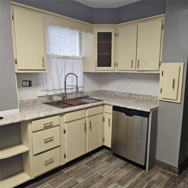 405 Penn Ave, New Brighton, PA 15061 - kitchen featuring stainless steel dishwasher, wood tiled floors, decorative backsplash, light countertops, and glass insert cabinets