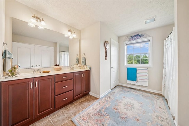 517 Callie Ct, Rostraver, PA 15089 - full bathroom with double vanity, a textured ceiling, and tile patterned flooring