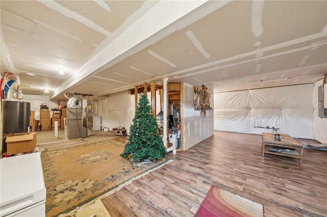 517 Callie Ct, Rostraver, PA 15089 - unfinished basement with wood finished floors, heating unit, and gas water heater