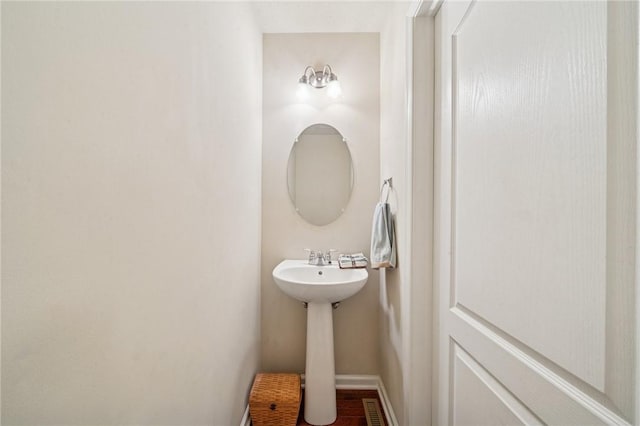 517 Callie Ct, Rostraver, PA 15089 - bathroom featuring baseboards and a sink