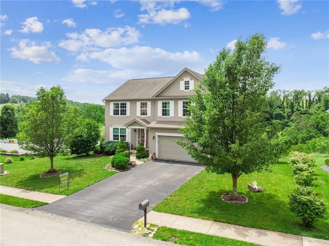 517 Callie Ct, Rostraver, PA 15089 - view of front of property featuring driveway, a garage, and a front yard