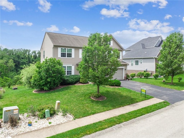 517 Callie Ct, Rostraver, PA 15089 - view of front of home with driveway, a garage, and a front lawn