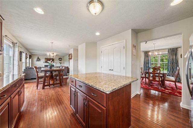 517 Callie Ct, Rostraver, PA 15089 - kitchen featuring a chandelier, dark wood-style floors, open floor plan, light stone countertops, and recessed lighting
