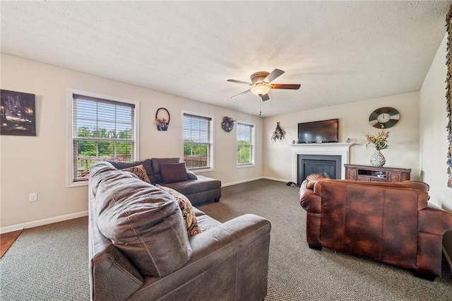 517 Callie Ct, Rostraver, PA 15089 - living room featuring a ceiling fan, a glass covered fireplace, and carpet floors