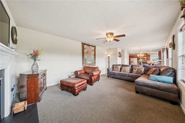 517 Callie Ct, Rostraver, PA 15089 - living room featuring carpet floors, a chandelier, a ceiling fan, and a fireplace