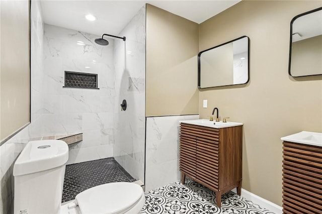 515 Peebles St, Wilkinsburg, PA 15221 - bathroom featuring tile walls, a marble finish shower, vanity, and recessed lighting