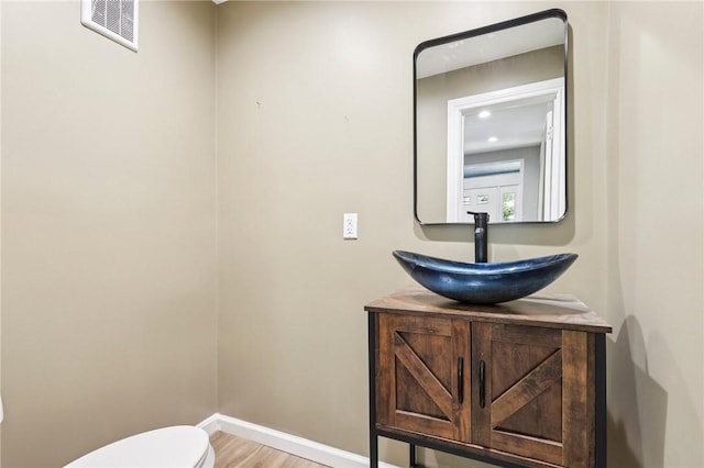 515 Peebles St, Wilkinsburg, PA 15221 - bathroom with vanity and wood finished floors