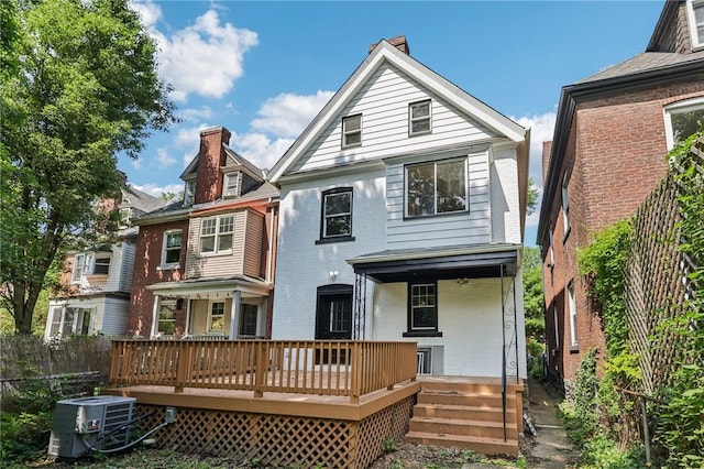 515 Peebles St, Wilkinsburg, PA 15221 - rear view of property featuring a chimney and brick siding