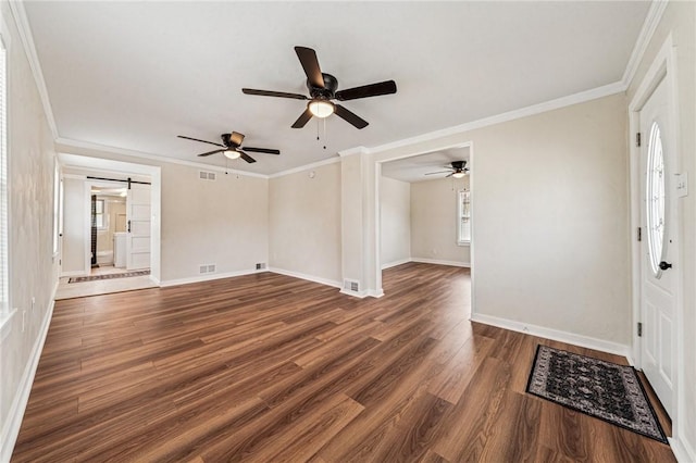 604 N 4th St, Jeannette, PA 15644 - foyer entrance featuring a barn door, wood finished floors, ceiling fan, and crown molding