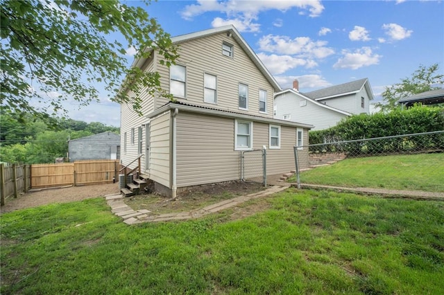 604 N 4th St, Jeannette, PA 15644 - rear view of house featuring a fenced backyard and entry steps
