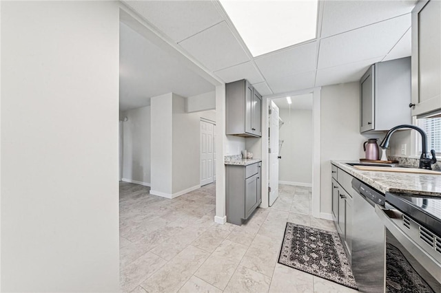 604 N 4th St, Jeannette, PA 15644 - kitchen featuring gray cabinets, stainless steel appliances, and light stone countertops