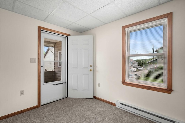26-28 Clopper St, Sewickley Twp, PA 15637 - empty room featuring baseboard heating, light carpet, and a drop ceiling