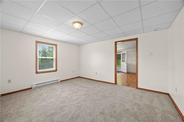 26-28 Clopper St, Sewickley Twp, PA 15637 - empty room featuring a baseboard heating unit, carpet, and a drop ceiling