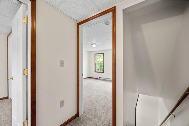 26-28 Clopper St, Sewickley Twp, PA 15637 - hallway featuring a drop ceiling, carpet, and a baseboard heating unit