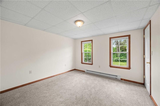 26-28 Clopper St, Sewickley Twp, PA 15637 - unfurnished room featuring a baseboard radiator, carpet flooring, and a paneled ceiling