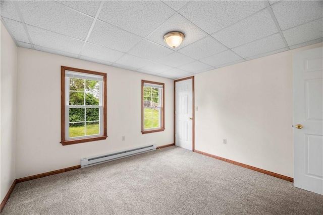 26-28 Clopper St, Sewickley Twp, PA 15637 - empty room featuring a baseboard radiator, carpet floors, and a paneled ceiling