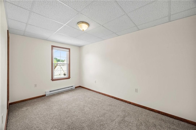 26-28 Clopper St, Sewickley Twp, PA 15637 - empty room with baseboard heating, a drop ceiling, and carpet flooring