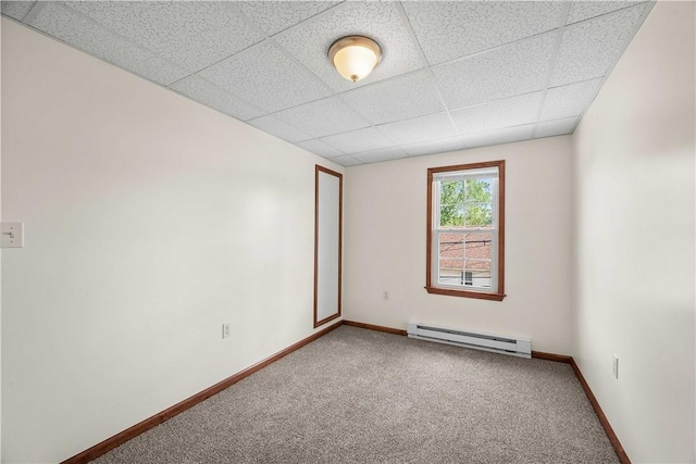 26-28 Clopper St, Sewickley Twp, PA 15637 - carpeted empty room with baseboard heating and a drop ceiling