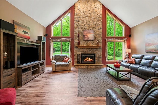 94 Troutman Rd, Pa, PA 16148 - living room with high vaulted ceiling, wood finished floors, and a stone fireplace