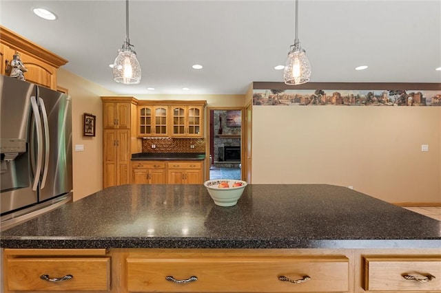 94 Troutman Rd, Pa, PA 16148 - kitchen with stainless steel fridge, dark countertops, glass insert cabinets, hanging light fixtures, and recessed lighting