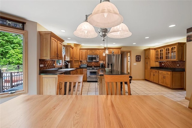 94 Troutman Rd, Pa, PA 16148 - kitchen featuring stainless steel appliances, light tile patterned floors, dark countertops, and recessed lighting