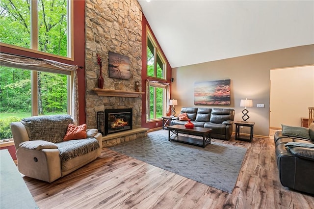 94 Troutman Rd, Pa, PA 16148 - living room featuring high vaulted ceiling, wood finished floors, and a fireplace