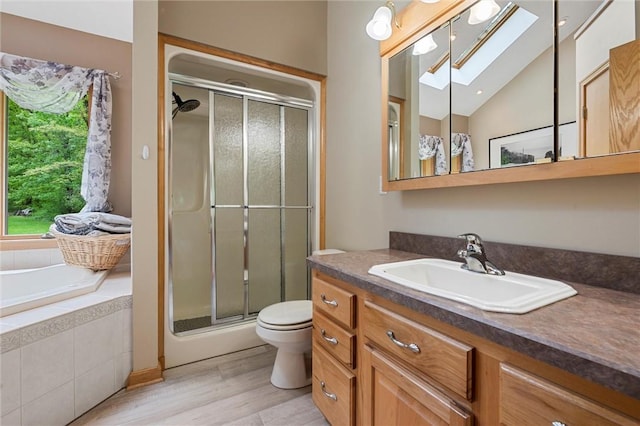 94 Troutman Rd, Pa, PA 16148 - bathroom featuring vanity, a skylight, a stall shower, wood finished floors, and lofted ceiling