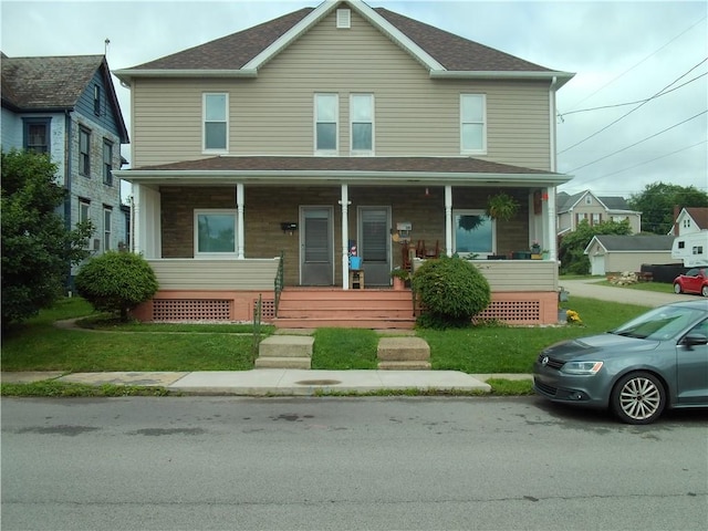 129-131 4th Ave, Scottdale, PA 15683 - view of front of property with a porch and a front yard