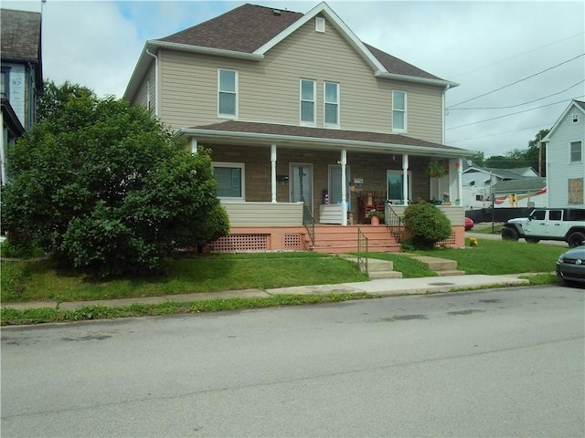 129-131 4th Ave, Scottdale, PA 15683 - view of front facade featuring a porch and a front lawn