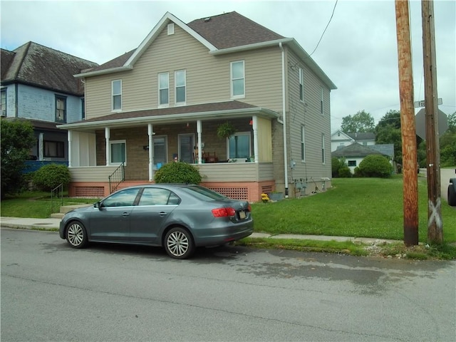 129-131 4th Ave, Scottdale, PA 15683 - view of front of home with a front lawn and a porch
